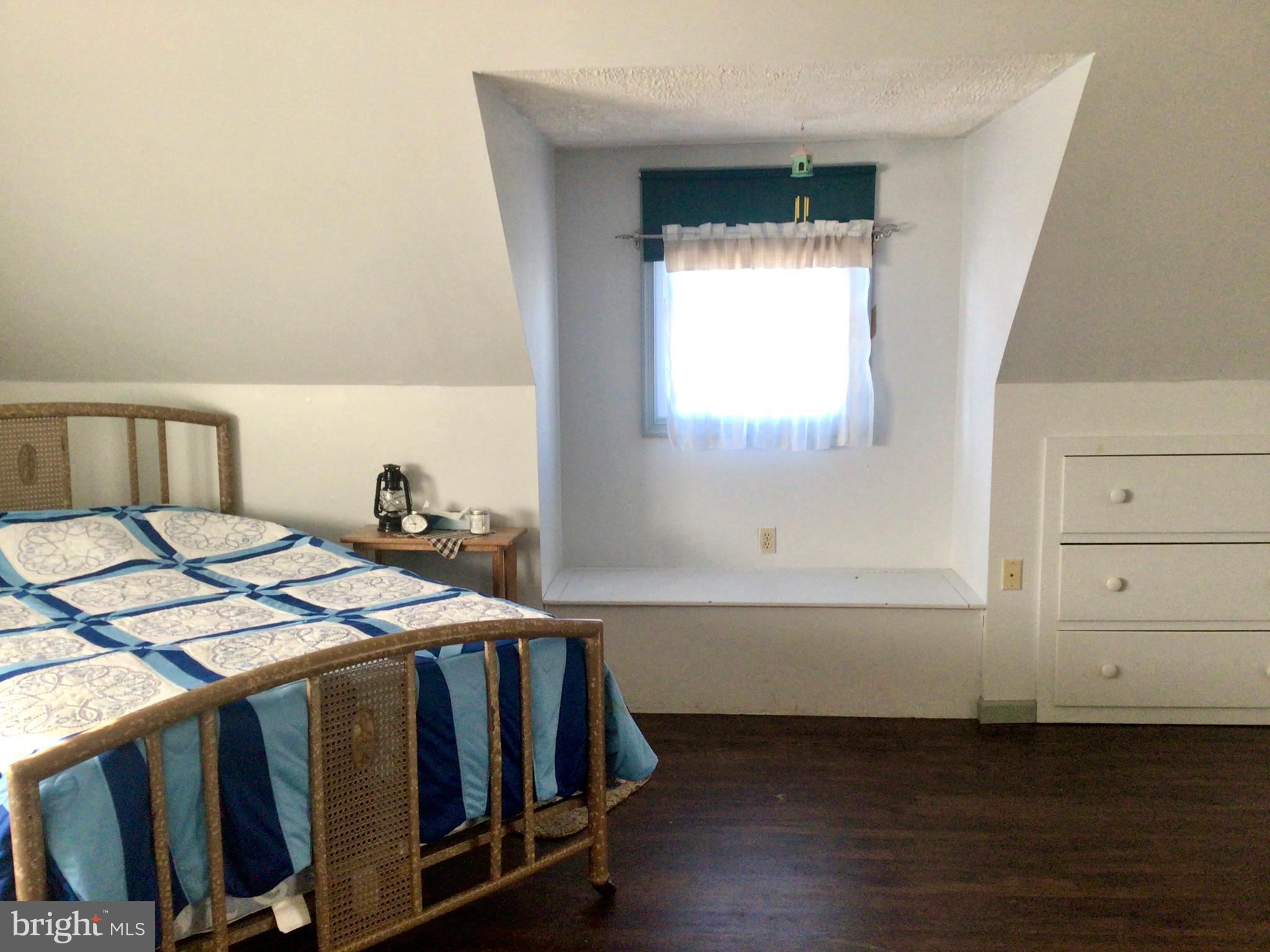 69 Fairview Road New Providence, PA 17560 - Photo 54 of 59 a bedroom with a bed and a window