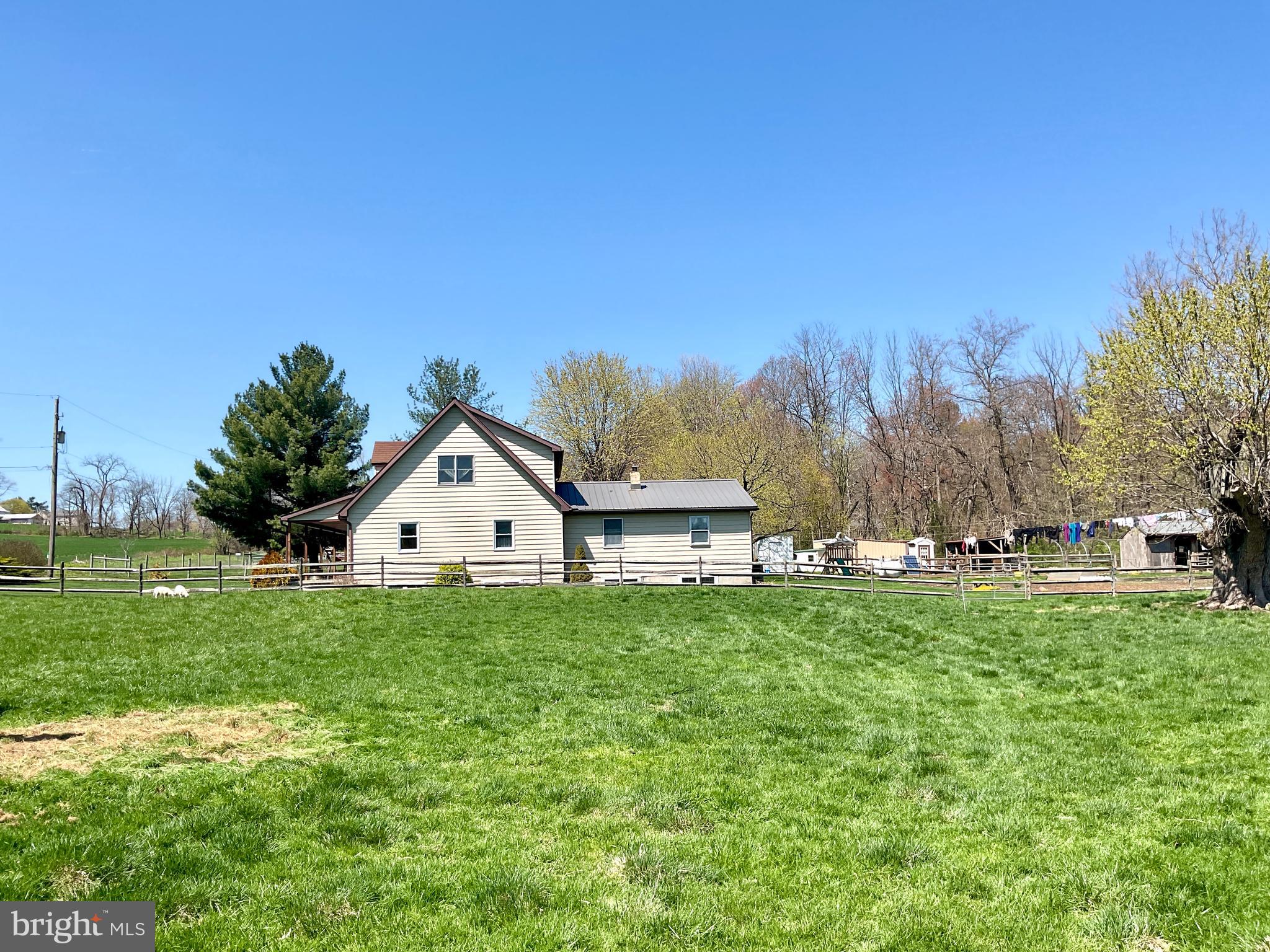 69 Fairview Road New Providence, PA 17560 - Photo 9 of 59 a front view of a house with a yard and trees