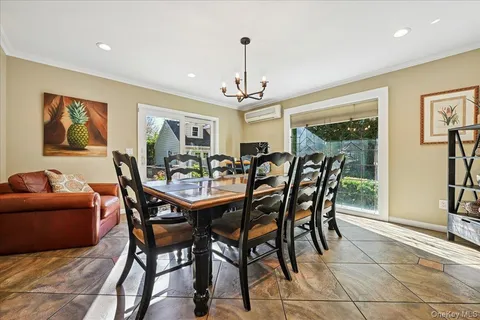 a view of a dining room with furniture window and outside view