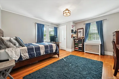 a bedroom with furniture and a rug