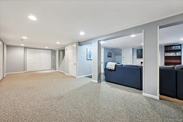 a large bedroom with furniture and closet