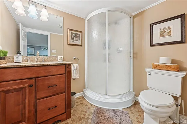 a bathroom with a toilet a sink and a mirror