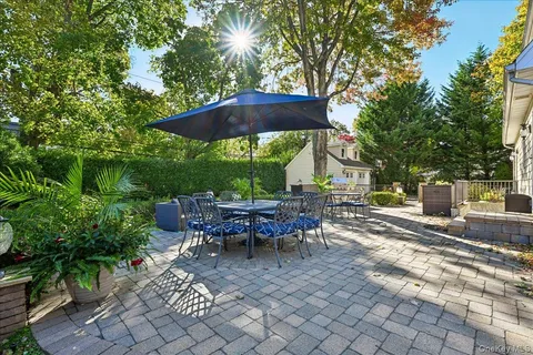 an outdoor space with furniture and umbrella