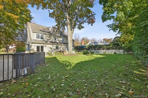 a view of a garden with a building in the background
