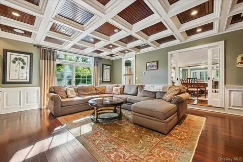a living room with furniture and wooden floors