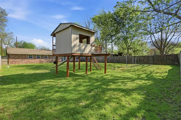 a view of a garden with a slide