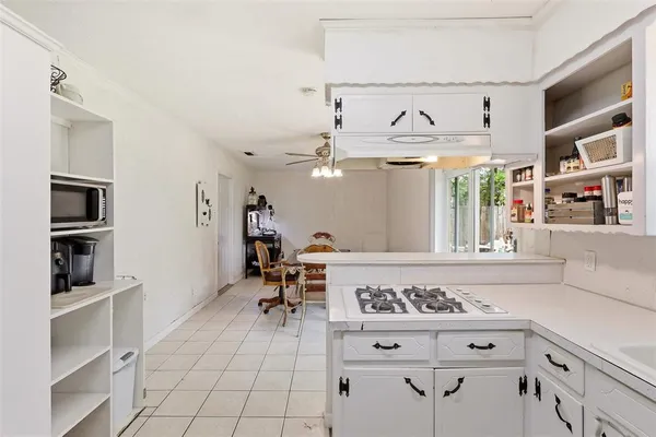 a view of kitchen with furniture and window