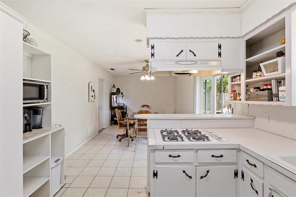 1803 Sycamore Street Commerce, TX 75428 - Photo 6 of 18 a view of kitchen with furniture and window