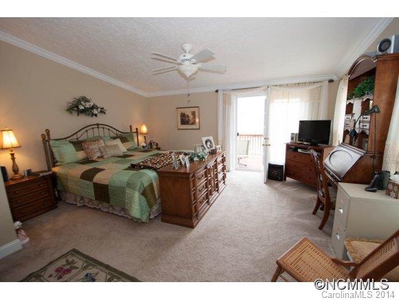 1081 Wesley Creek Road Clyde, NC 28721 - Photo 11 of 24 a bed room with a bed window and a chair