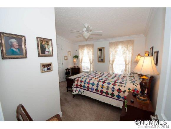 1081 Wesley Creek Road Clyde, NC 28721 - Photo 14 of 24 a bedroom with a bed and a lamp with window
