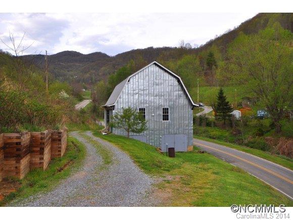 1081 Wesley Creek Road Clyde, NC 28721 - Photo 22 of 24 a view of a house with a yard