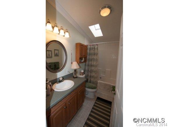 1081 Wesley Creek Road Clyde, NC 28721 - Photo 23 of 24 a bathroom with a toilet and a sink