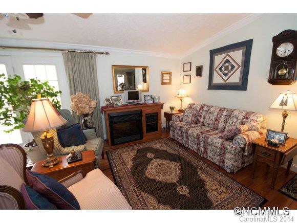 1081 Wesley Creek Road Clyde, NC 28721 - Photo 5 of 24 a living room with furniture and a flat screen tv