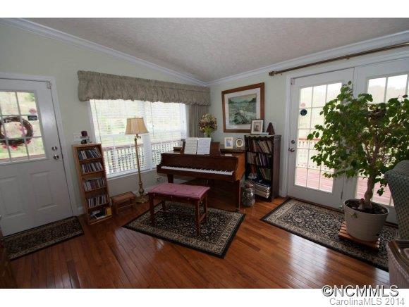 1081 Wesley Creek Road Clyde, NC 28721 - Photo 7 of 24 a living room with furniture a window and a potted plant