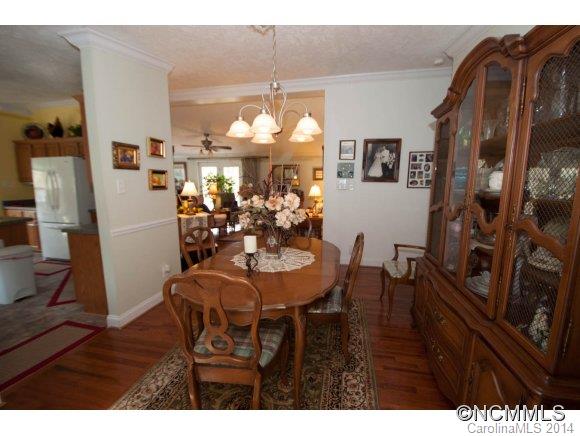 1081 Wesley Creek Road Clyde, NC 28721 - Photo 9 of 24 a view of a dining room with furniture and wooden floor
