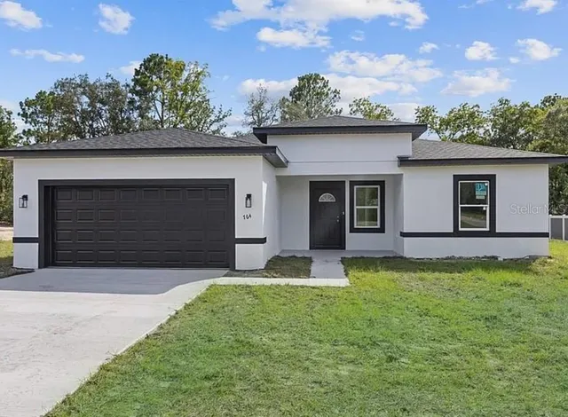 front view of a house with a yard