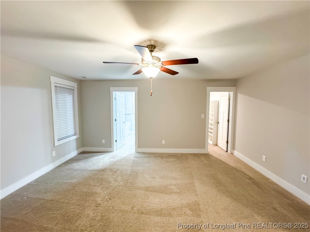 144 Deaton Road Raeford, NC 28376 - Photo 17 of 24 a view of an empty room with a ceiling fan