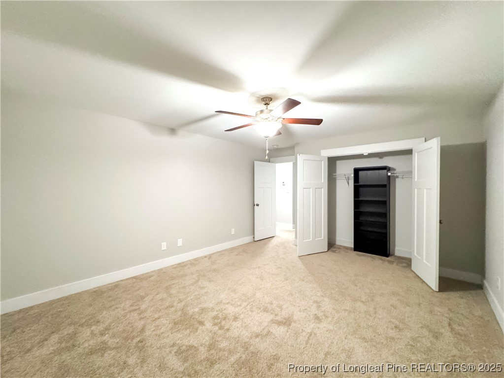 144 Deaton Road Raeford, NC 28376 - Photo 18 of 24 an empty room with closet and a ceiling fan