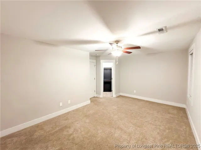 an empty room with a bathroom