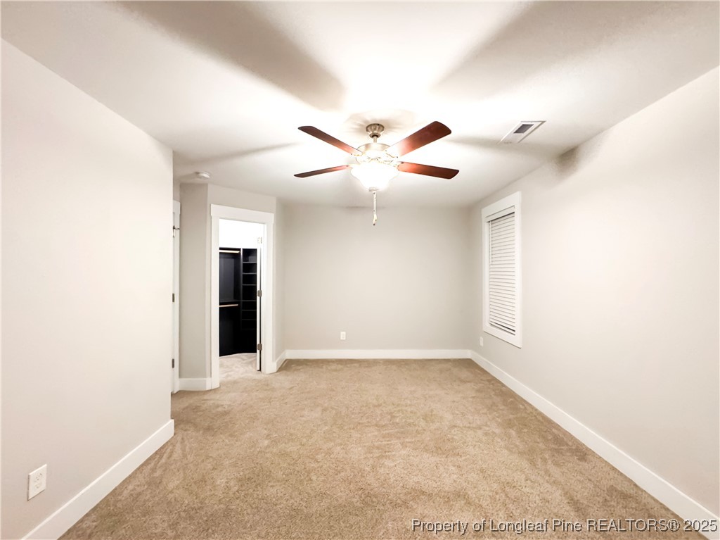144 Deaton Road Raeford, NC 28376 - Photo 24 of 24 an empty room with ceiling fan and window