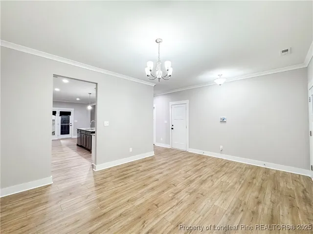 a view of a livingroom with wooden floor