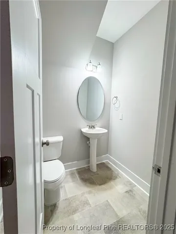 a bathroom with a toilet and a sink