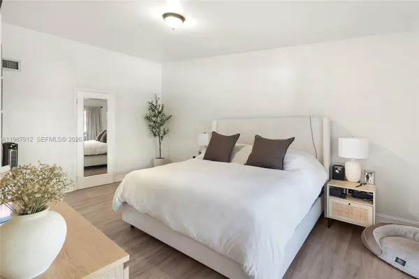 a bed room with a bed and a couch