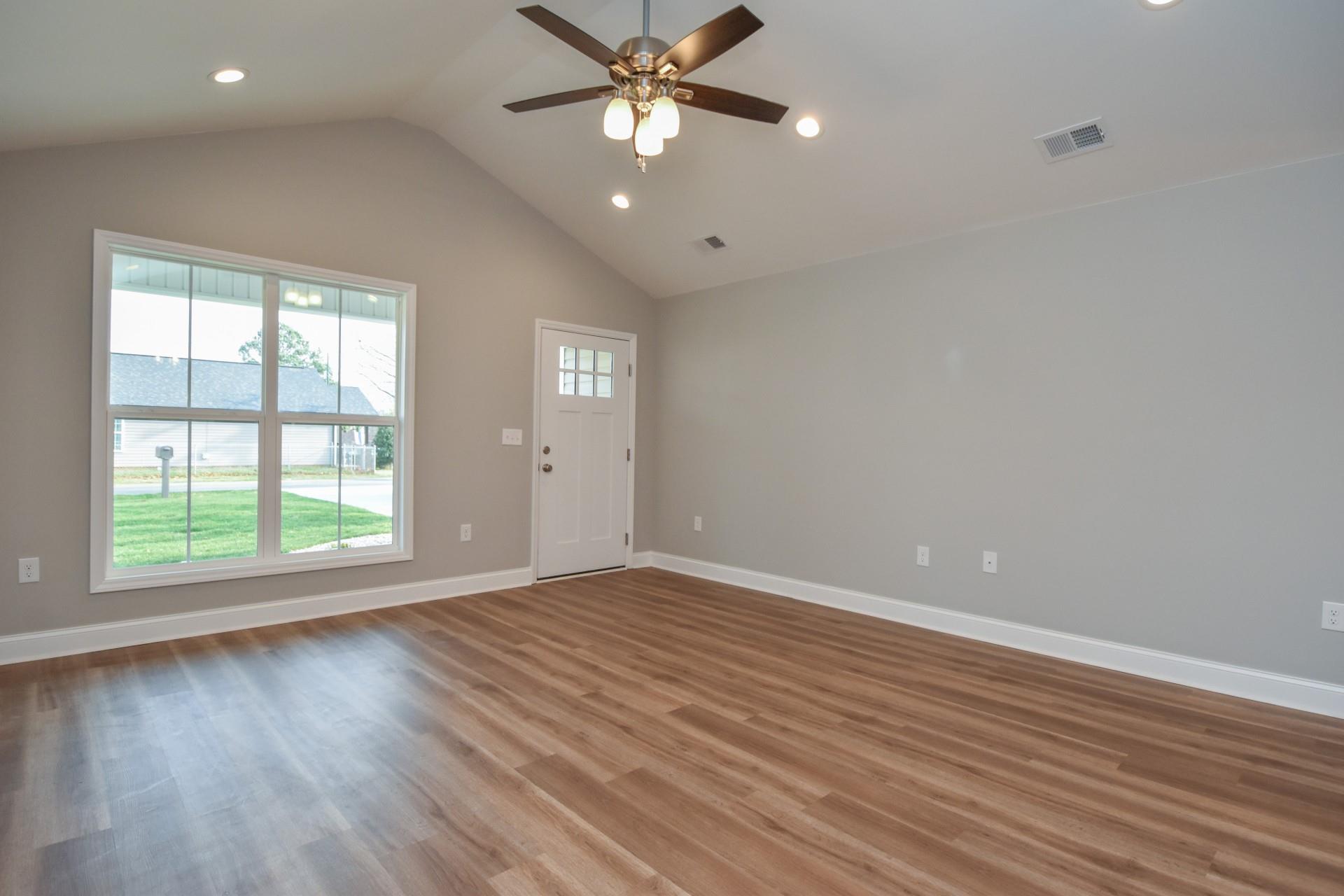 680 Union Cemetery Road Southwest Concord, NC 28027 - Photo 8 of 26 wooden floor in an empty room with a window