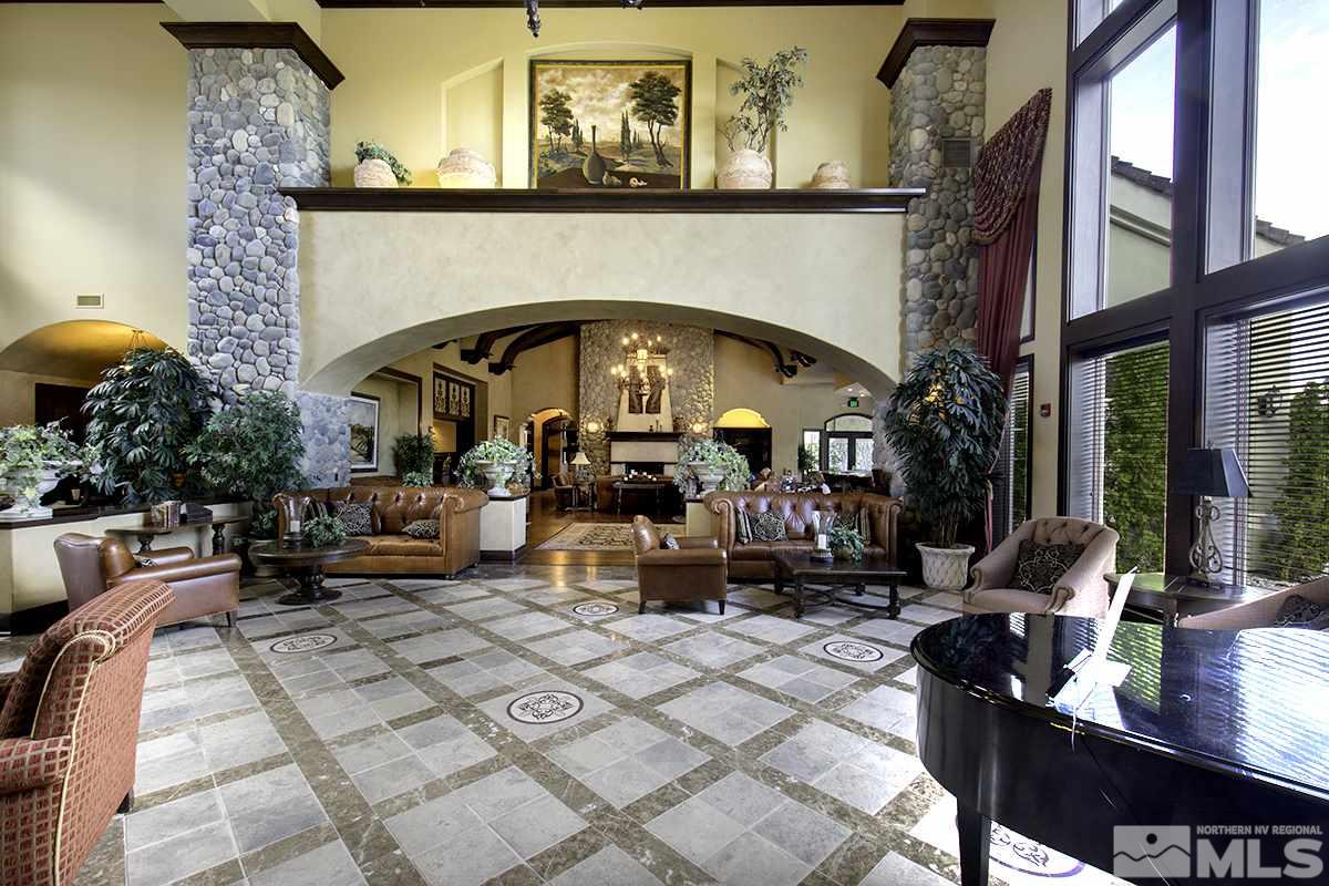 9900 Wilbur May Parkway, Unit 3404 Reno, NV 89521 - Photo 3 of 4 a living room with fireplace furniture and a potted plant