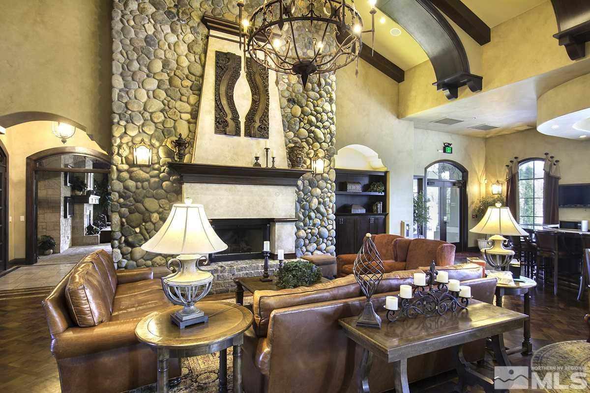 9900 Wilbur May Parkway, Unit 3404 Reno, NV 89521 - Photo 4 of 4 a living room with fireplace furniture and a chandelier