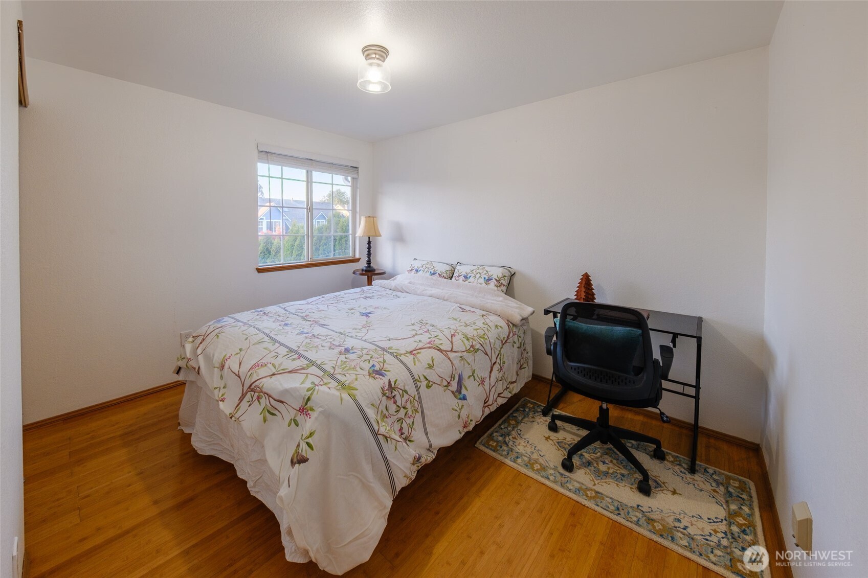 830 234th Street Southeast Bothell, WA 98021 - Photo 14 of 26 a bedroom with a bed chair and a window