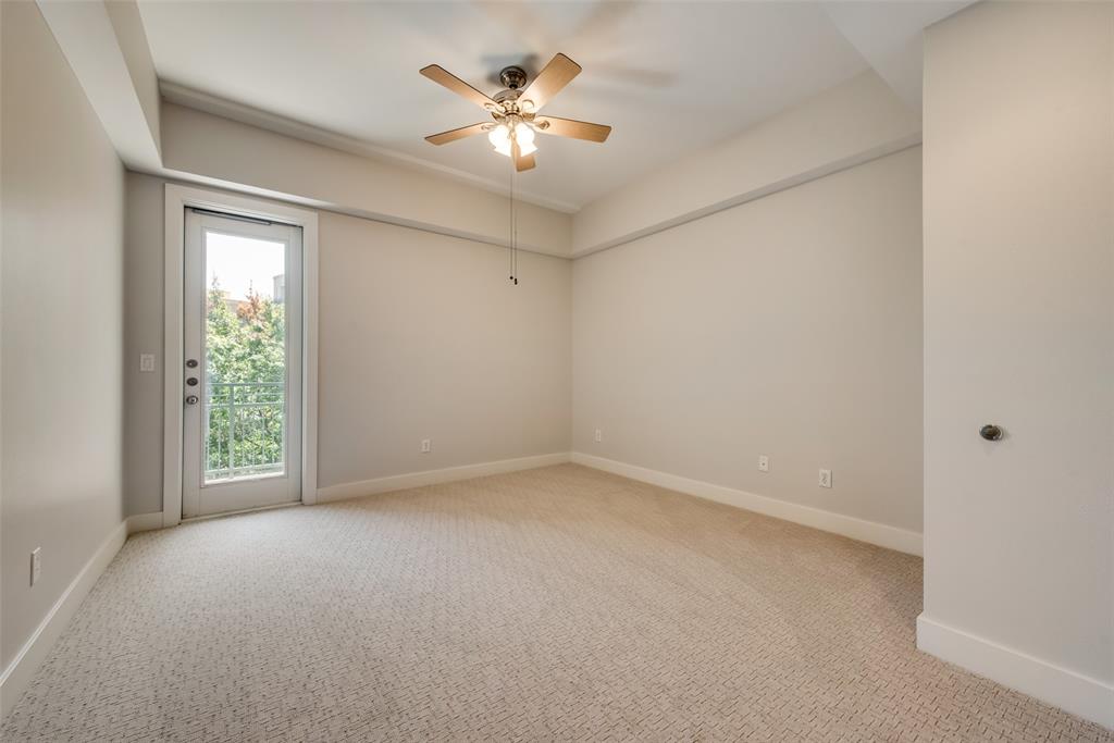 5055 Addison Circle, Unit 407 Addison, TX 75001 - Photo 18 of 22 Primary Bedroom's has Small Balcony with View of Grounds