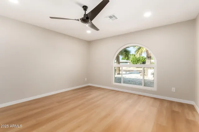 a bathroom with a sink a mirror and a vanity