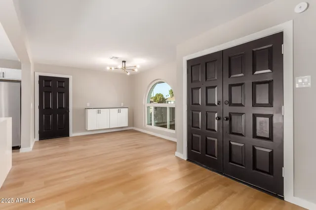 a view of empty room with front door