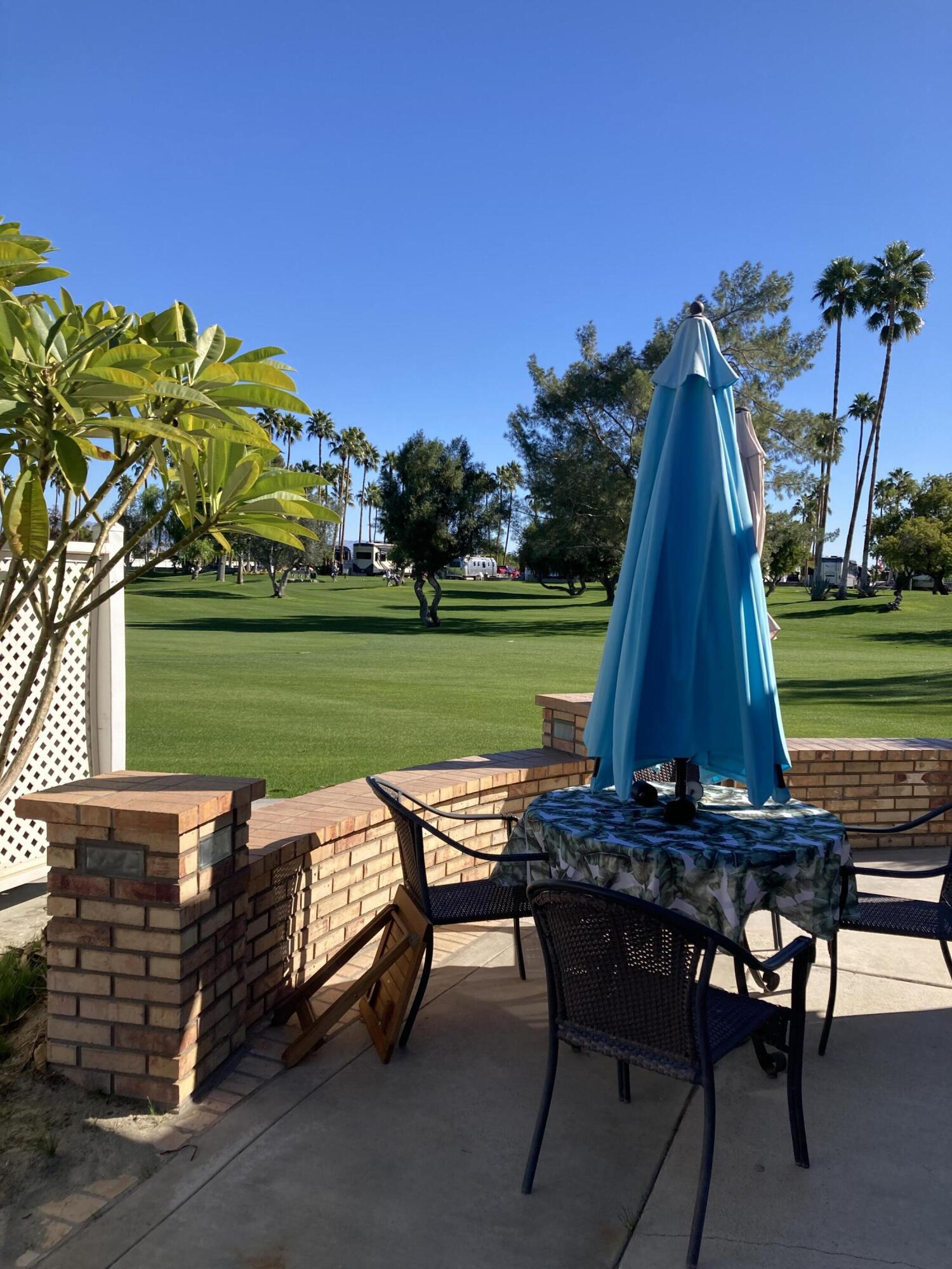 69411 Ramon Road, Unit 776 Cathedral City, CA 92234 - Photo 14 of 17 a view of a outdoor sitting area with furniture and garden