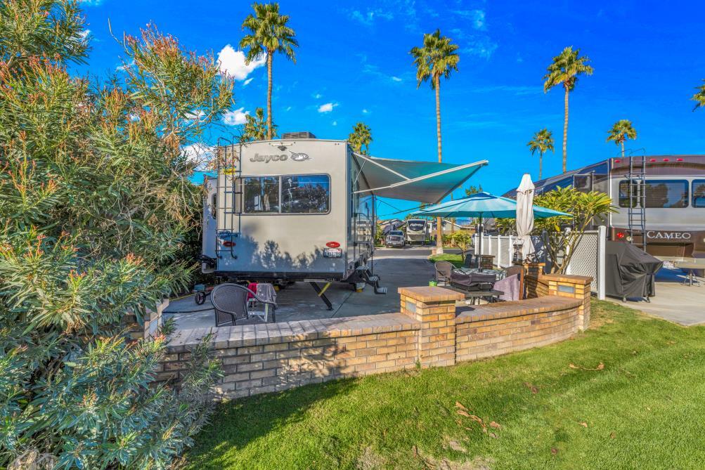 69411 Ramon Road, Unit 776 Cathedral City, CA 92234 - Photo 8 of 17 a view of a house with sitting area and garden