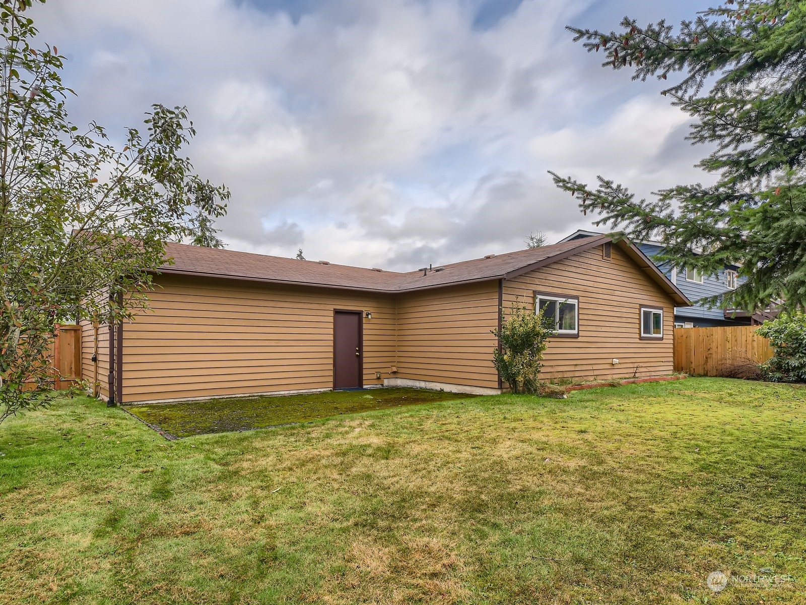 416 213th Street Southwest Bothell, WA 98021 - Photo 12 of 12 a view of a house with a yard and garage