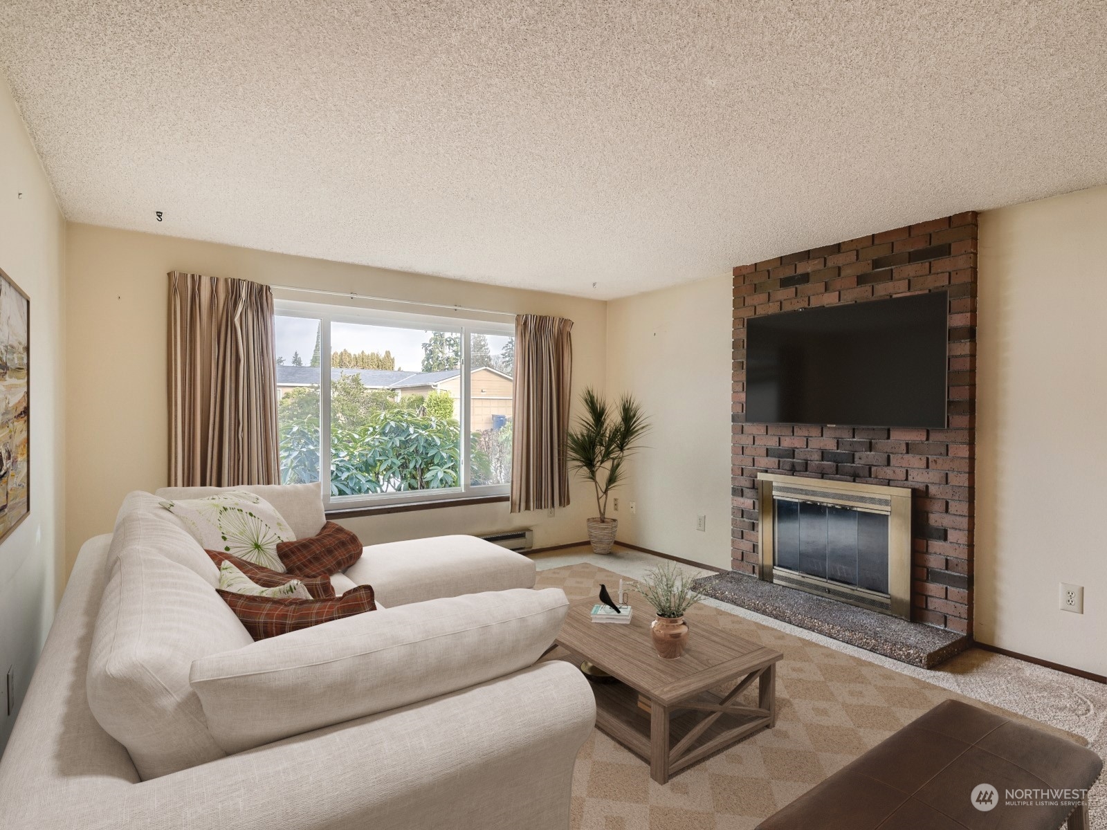 416 213th Street Southwest Bothell, WA 98021 - Photo 2 of 12 a living room with furniture a fireplace and a flat screen tv
