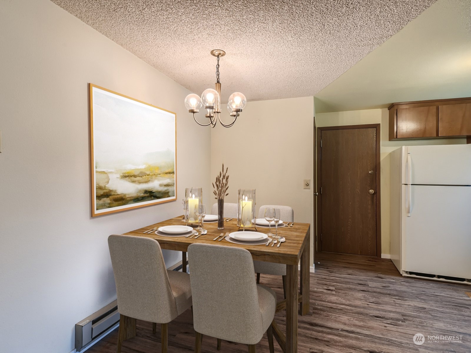 416 213th Street Southwest Bothell, WA 98021 - Photo 4 of 12 a dining room with furniture a chandelier and wooden floor