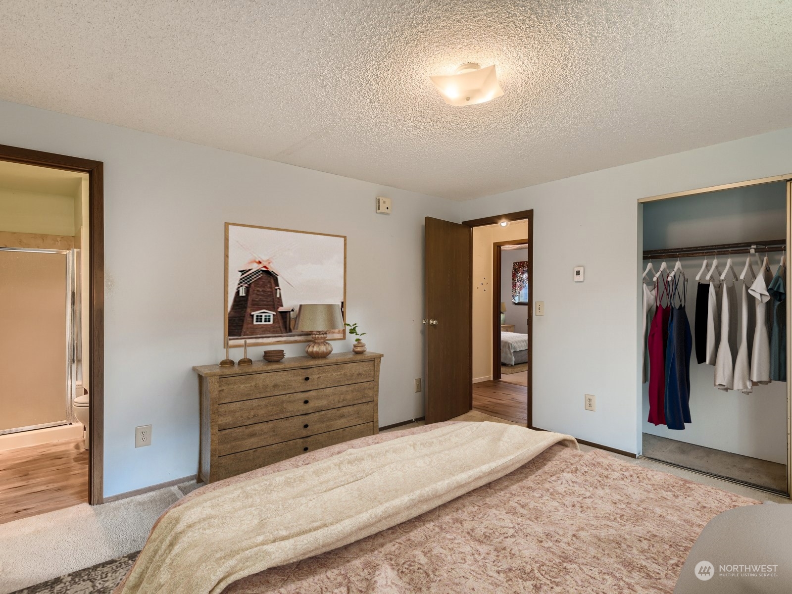 416 213th Street Southwest Bothell, WA 98021 - Photo 7 of 12 a bedroom with a bed and a view of bathroom