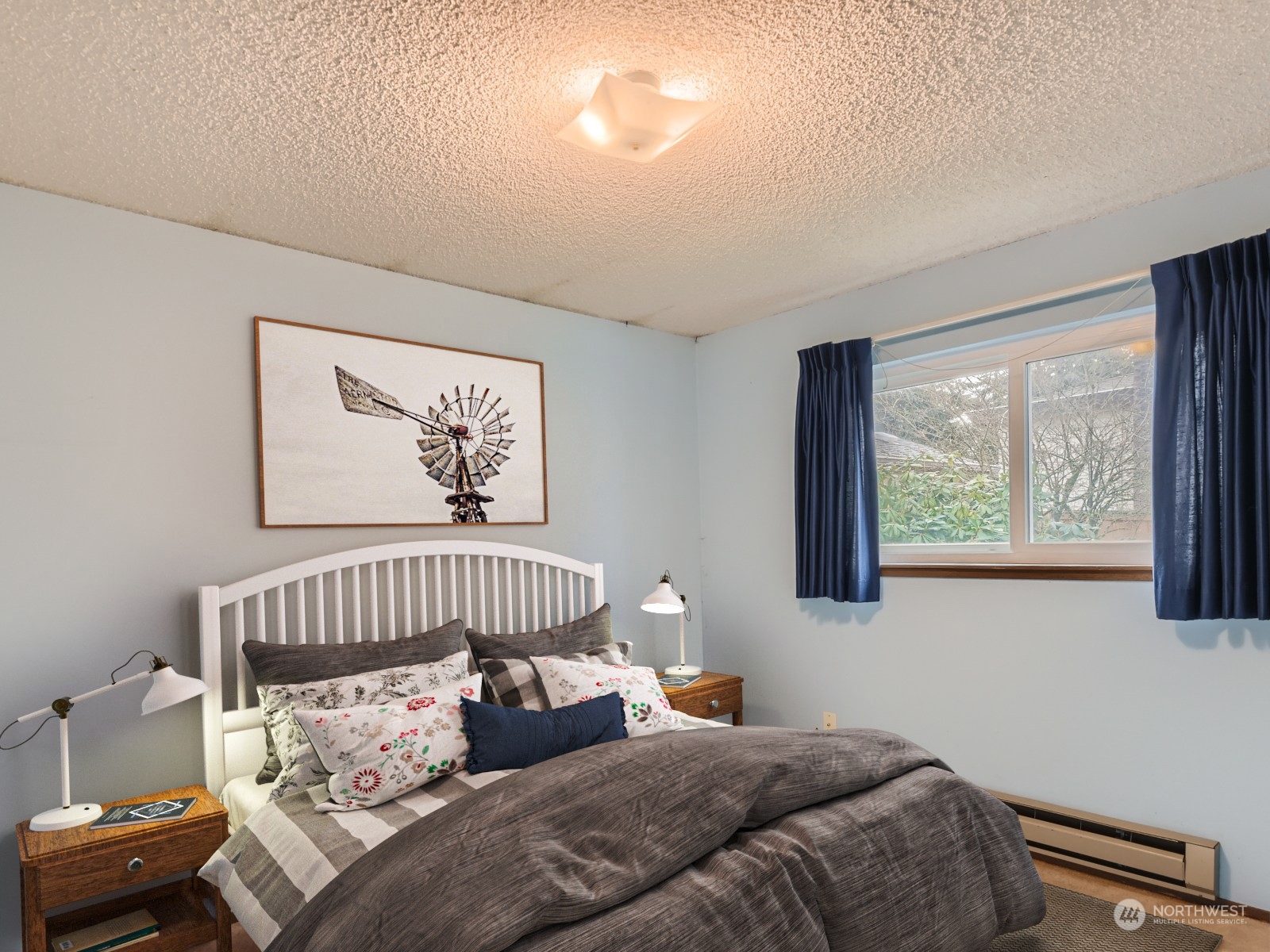 416 213th Street Southwest Bothell, WA 98021 - Photo 9 of 12 a bedroom with a bed and window