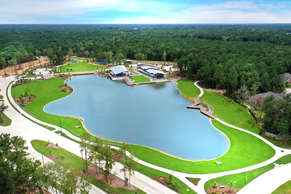 15650 Turtlehead Trail Conroe, TX 77302 - Photo 36 of 41 a view of a swimming pool with a garden and trees