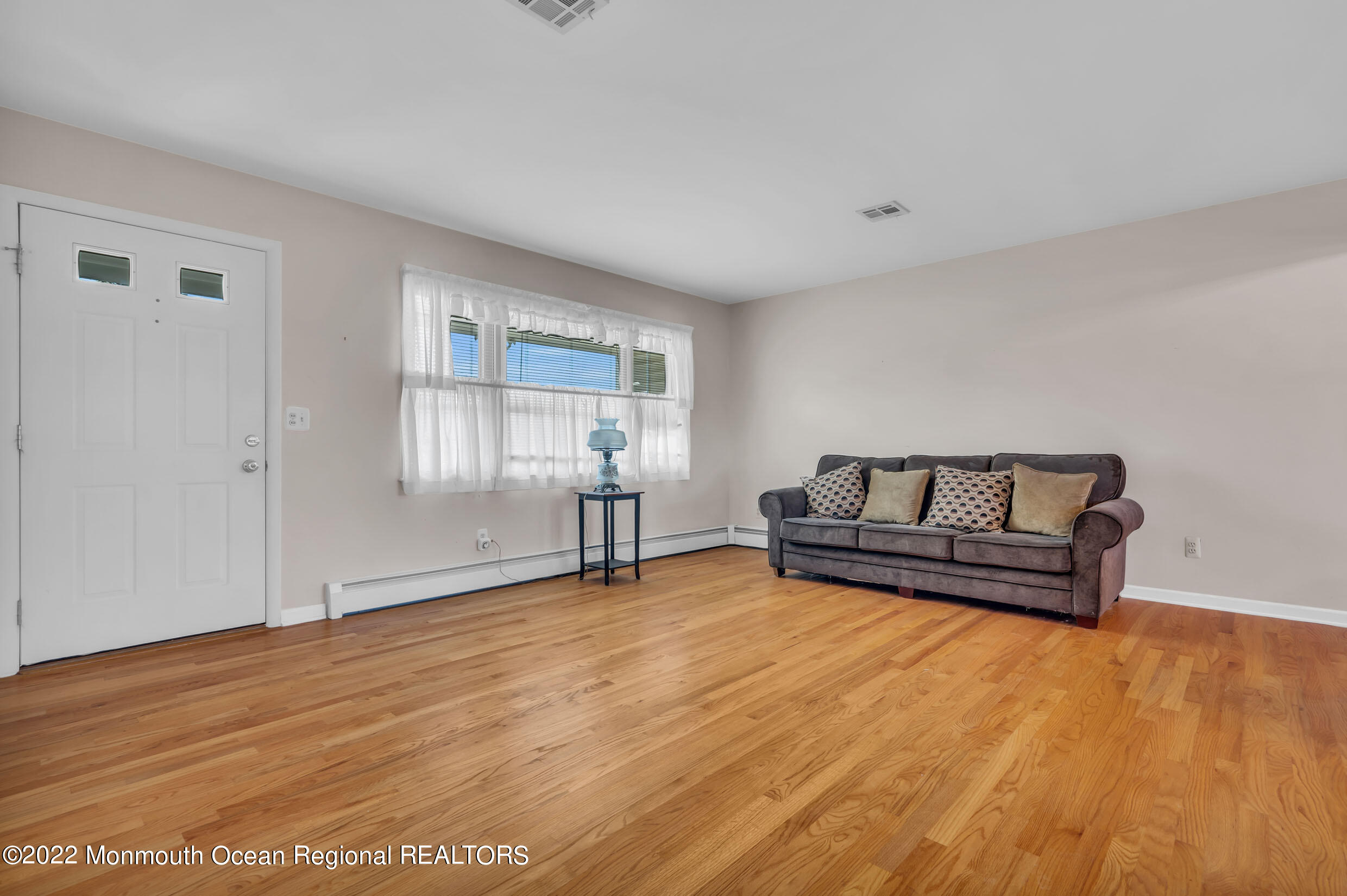 7 Mapleton Road Toms River, NJ 08757 - Photo 5 of 28 a living room with couch and wooden floor