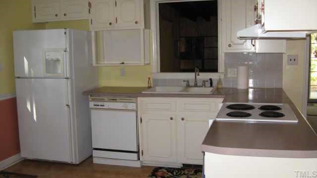 3205 Edgestone Drive Raleigh, NC 27604 - Photo 3 of 5 a kitchen with a refrigerator and a sink