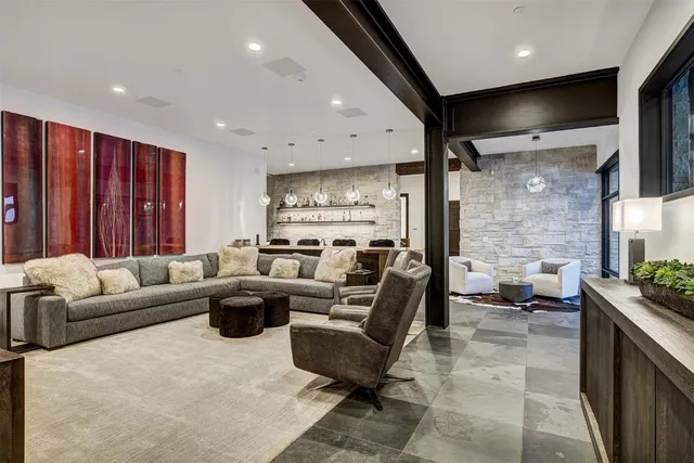 a kitchen with stainless steel appliances kitchen island granite countertop a stove a sink and a refrigerator