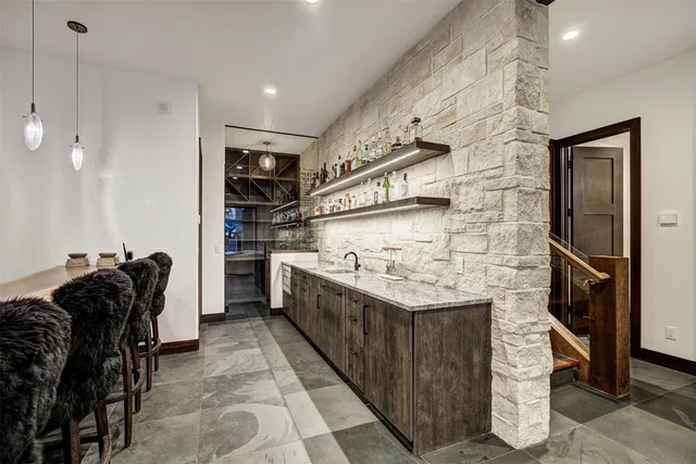 a bathroom with a sink toilet and mirror