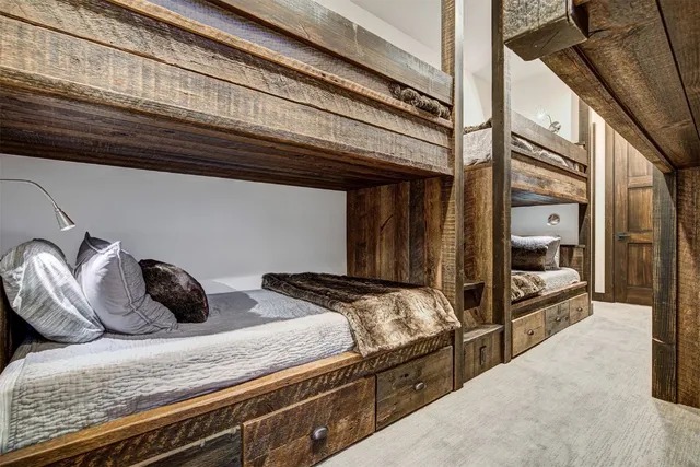 a bedroom with a bed and a mirror