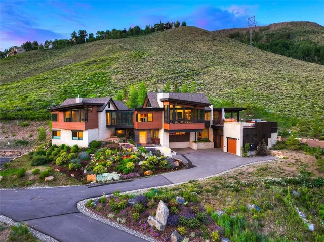 a view of a town with mountains in the background
