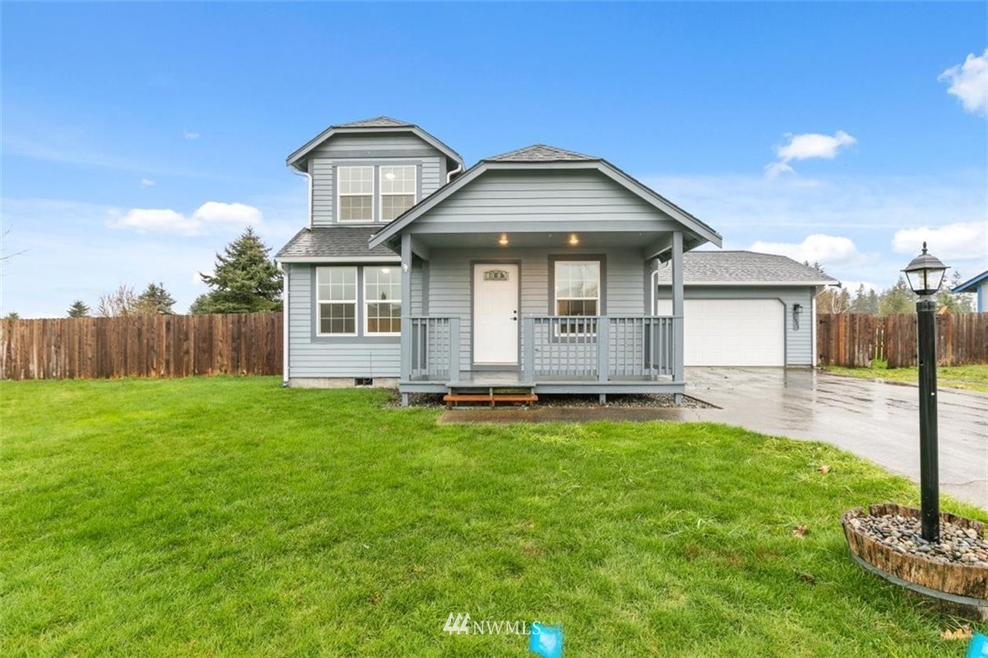 17923 Charlotte Place Southwest Rochester, WA 98579 - Photo 1 of 24 a front view of a house with a yard