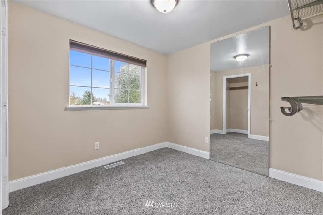 17923 Charlotte Place Southwest Rochester, WA 98579 - Photo 20 of 24 a view of an empty room with a window